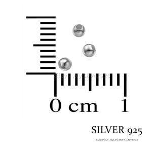May include: Three silver beads measuring 0.5 cm in diameter. The beads are shown next to a ruler with centimeter markings.