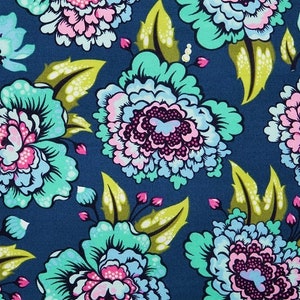 May include: A blue fabric with a floral pattern. The flowers are pink, blue, and green. The fabric has a vintage feel.