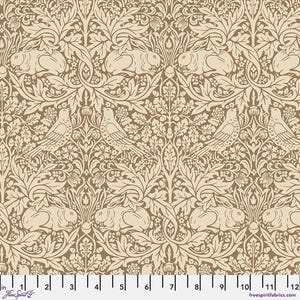 May include: A fabric in shades of tan and cream, featuring a repeating pattern of birds, rabbits, and foliage. The design showcases detailed illustrations of animals and plants, creating a classic, nature-inspired aesthetic. The fabric has a vintage, decorative style.