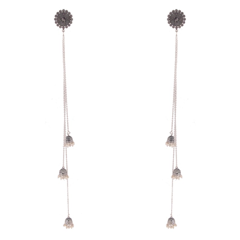 May include: A pair of silver dangle earrings with three small bells on each earring. The bells have a silver finish and are decorated with intricate designs.