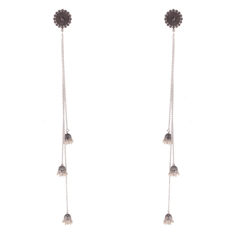 May include: A pair of silver dangle earrings with three small bells on each earring. The bells have a silver finish and are decorated with intricate designs.