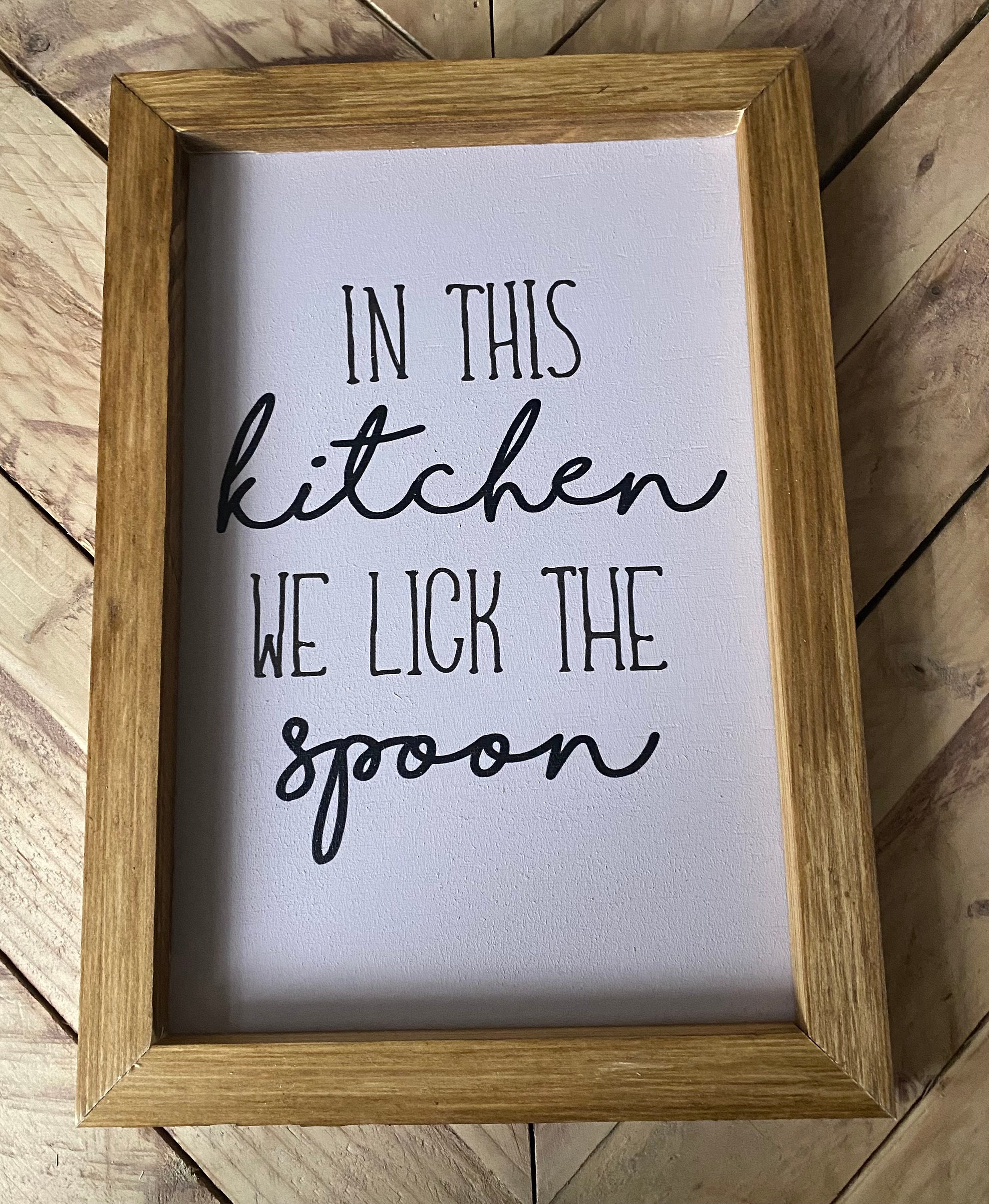 In This Kitchen We Lick The Spoon Sign