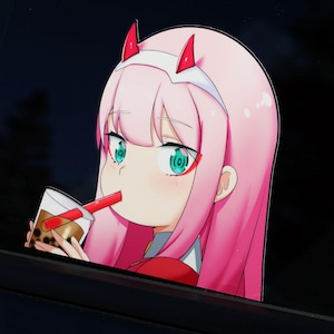 May include: An anime character with pink hair, red horns and a white headband is drinking from a brown cup with a red straw. The character has large green eyes and a red line under each eye. The character is looking to the left.