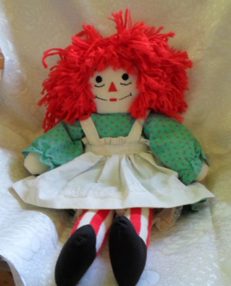 doll with red yarn hair