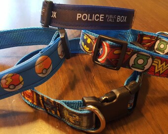 May include: Three dog collars with different designs. The first collar is blue with Pokemon characters, the second is blue with superhero characters, and the third is blue with a "Police Public Call Box" design.