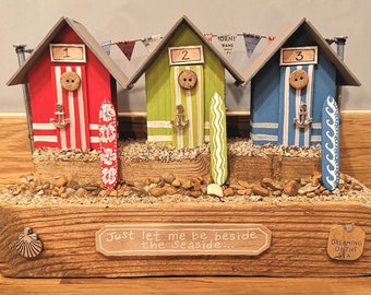 Vibrant Wooden Beach Hut Trio with Surfboards in Red, Green, Blue and White - Beach, Coastal Themed Gift.