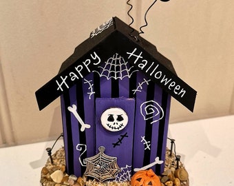 Purple and Black Happy Halloween Beach Hut with Pumpkins and Spider's Web.