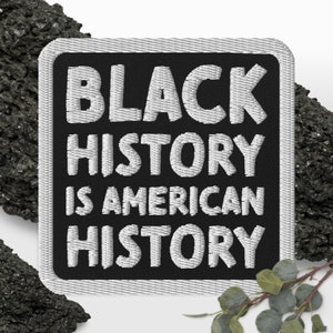 May include: Black and white embroidered patch with the text "Black History is American History".