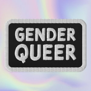 May include: Black embroidered patch with white text that reads "GENDER QUEER".
