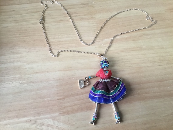 Doll necklace with colourfull rhinestones added