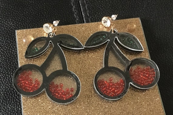 Imperfect cherry shaker earrings glue marks to acrylic