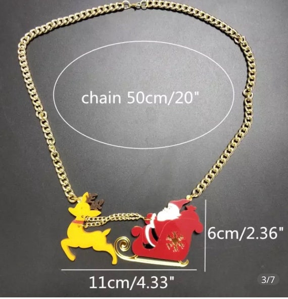 Acrylic santa on sleigh with reindeer necklace on goldtone chain