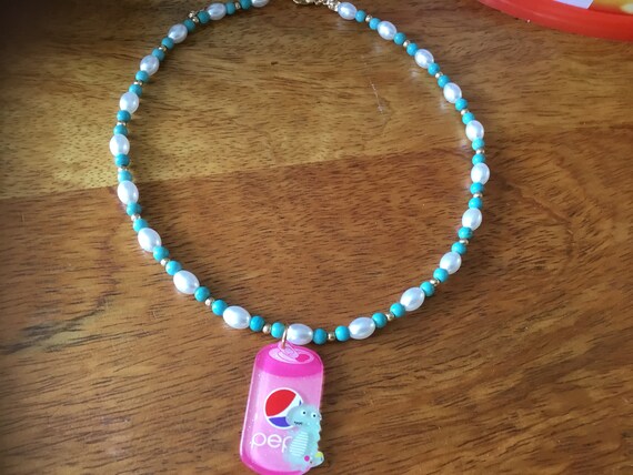 Necklace with glittery soda can attached 14 inch long necklace