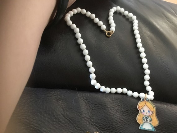 Vintage glass white bead necklace 14 inch with added cinderella charm