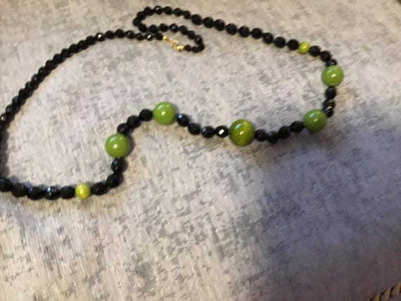 vintage 1990s ish era black glass faceted bead necklace with green plastic beads 30 inch