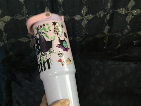 insulated cup with carry handle villains motif on