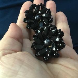 1950s clip on cluster glass earrings black with grey centre