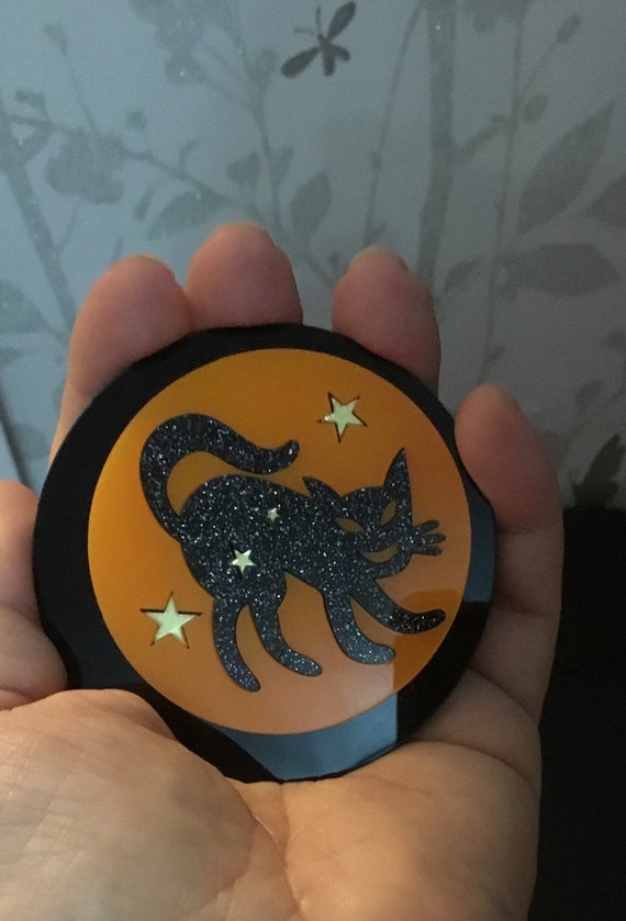 Large glittery cat acrylic brooch on orange moon