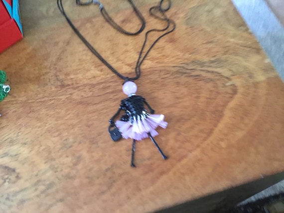 doll necklace pinktone skirt and head