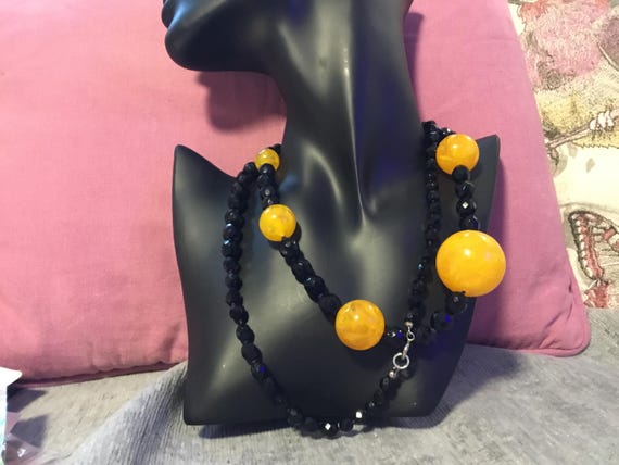 vintage 1990s facted black glass bead necklace with orange plastic balls 36 inch