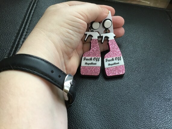 Novelty f*** o** repellant earrings pink glitter detail