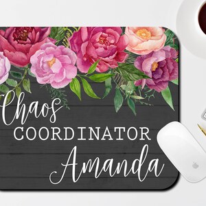 May include: A black and white floral mouse pad with the text "Chaos Coordinator Amanda".