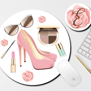 May include: A white round mouse pad with a pink high heel shoe, a pair of sunglasses, a pink lipstick, a mascara wand, a pink eyeshadow palette, a bottle of nail polish, and pink roses.