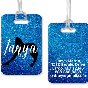 May include: Blue glitter luggage tag with a black silhouette of a gymnast in a backbend pose. The name "Tanya" is written in white cursive script. The back of the tag has contact information: Tanya Martin, 1230 Brooks Drive, Largo, MD 12345, 888-888-8888, sydney@gmail.com.