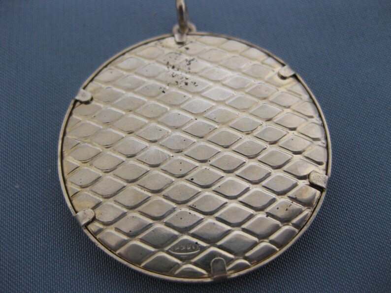 Sterling silver pendant with cloisonne enamel.