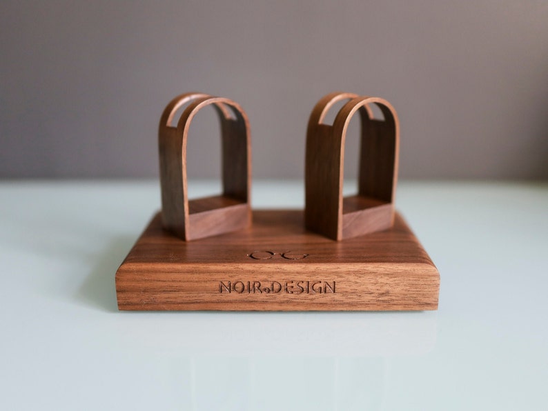 Eyeglasses stand placed on desk made from solid black walnut