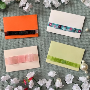 Enveloppes - cartes-cadeaux - rubans et noeuds