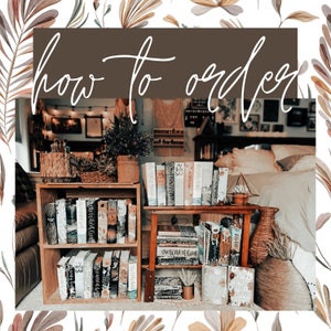 May include: A wooden bookshelf with multiple rows of books, including several copies of "The Word of God". The bookshelf is in a home setting with a brown sofa and a wooden table with a wicker basket.