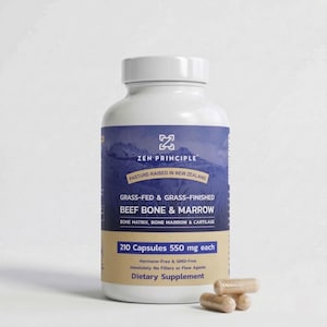 May include: A white bottle of Zen Principle dietary supplement with a blue and tan label. The label reads "Grass-Fed & Grass-Finished Beef Bone & Marrow" and "210 Capsules 550 mg each." Three capsules are visible in front of the bottle.