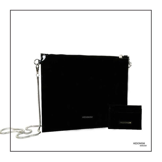 black handbag with long strap