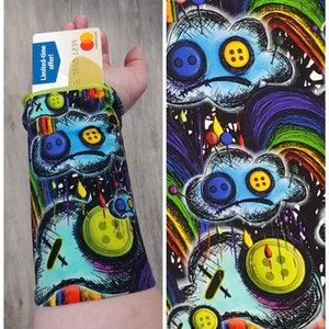 Custom Wrist Wallet, Wrist Wallet, Ring Holder, Rainbow, Rainbow Cloud, Rainbow Skull, Reversible, Running Wallet, Cuff, Gift For Everyone Sad Rainbow Cloud