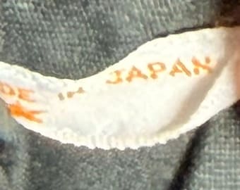 Bolso de mano vintage de los años 40 con cierre tipo concha y estampado jacquard.