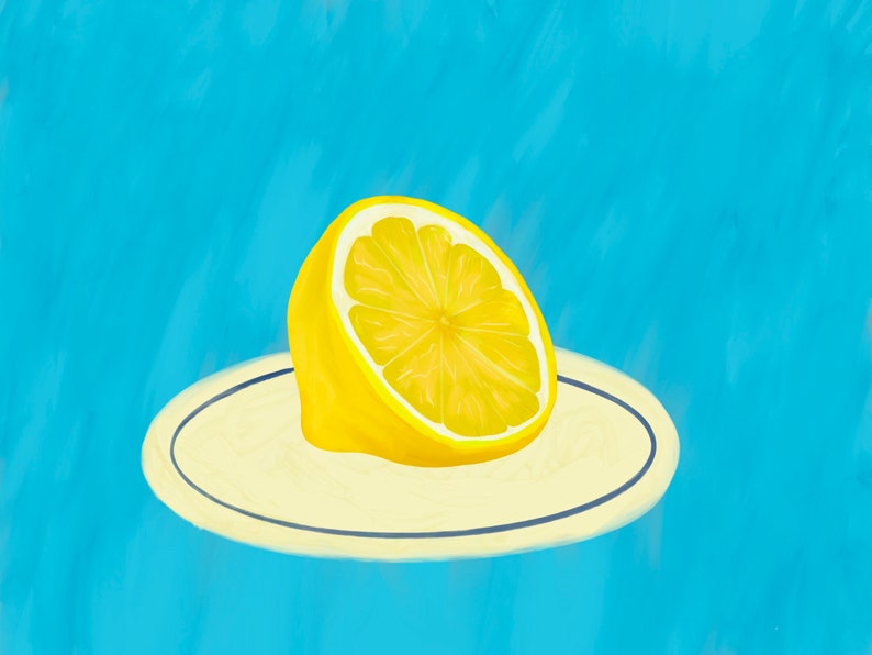 May include: A halved lemon on a white plate with a blue rim, against a light blue background.