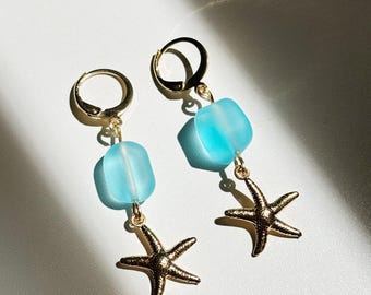 Pendientes impermeables de oro con cristales marinos y estrellas de mar