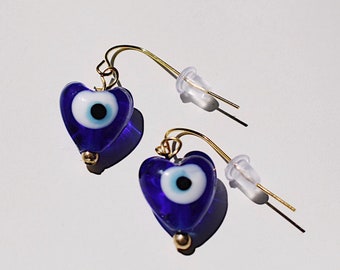 hart boze oog gouden waterdichte oorbellen