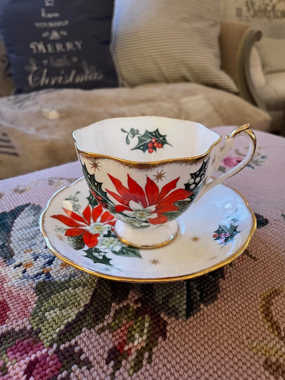 Vintage Queen Anne Noel Bone china teacup and saucer Gold rimmed Made in England Christmas Poinsettia print