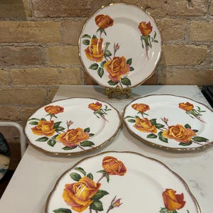 Vintage Queen Anne Royal Roses Sutters Gold yellow rose plates. Set fo four.