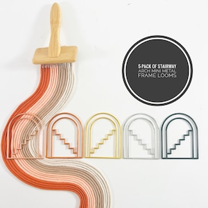 May include: Five-pack of stairway arch mini metal frame looms in gold, copper, silver, and green. The looms are arranged in a row on a white background. A wooden paintbrush with orange, beige, and white yarn is in the top left corner of the image.