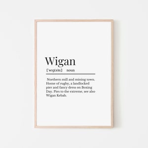 May include: A black and white printable art print with the word "Wigan" defined as a northern mill and mining town, home of rugby, a landlocked pier, and fancy dress on Boxing Day. The print also mentions Wigan Kebab.