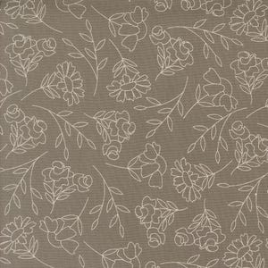 May include: A seamless pattern of white floral designs on a brown background. The pattern features various stylized flowers and leaves.