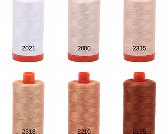 May include: Six spools of thread in various shades of beige and brown. The spools are labeled with the numbers 2021, 2000, 2315, 2318, 2210, and 2155.
