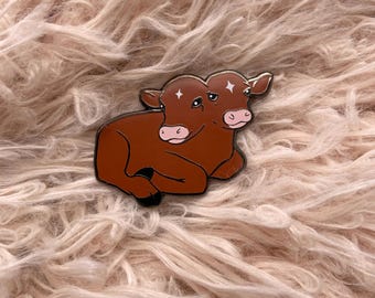 Pin de esmalte de becerro de dos cabezas de color marrón rojizo
