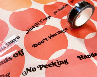 Cinta transparente para envolver regalos navideños "Hands Off"