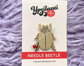 Recordatorio magnético de agujas Needle Beetle: revestimiento ligeramente defectuoso