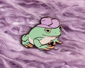 Pin de esmalte de rana vaquera