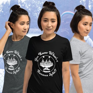 May include: Three women wearing t-shirts with a white graphic of a banana split and the text "You Know What's a Banana Split?" The shirts are in three different colors: gray, black, and light gray.